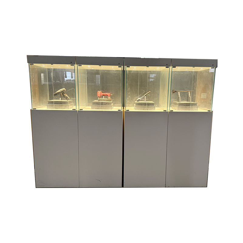 How do display cabinets enhance the appeal and visual depth of merchandise?